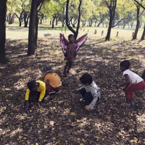 children playing in leaves, benefits of nature for children