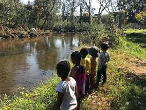 children at a river, benefits of nature for preshoolers